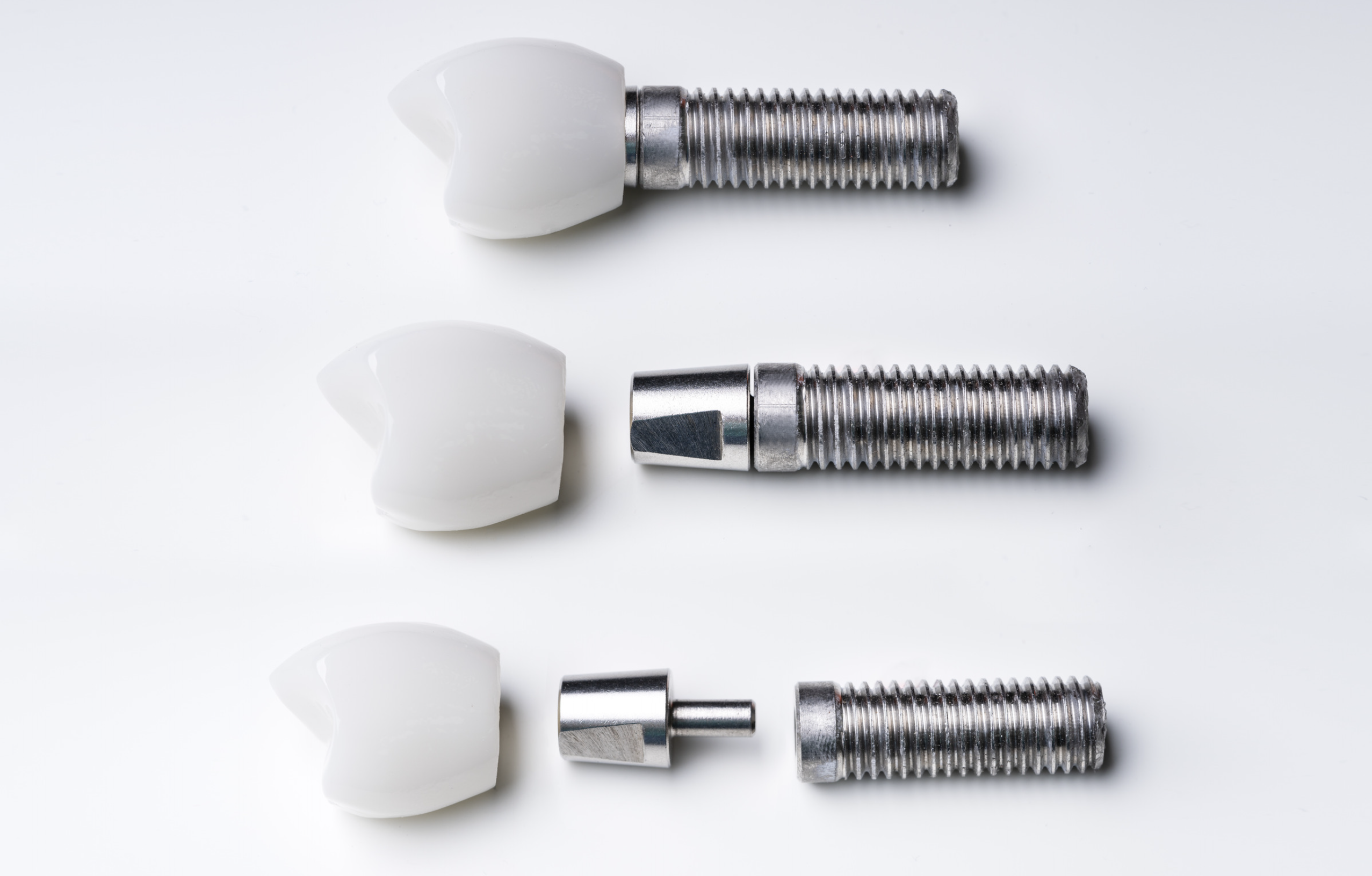 Parts of a dental implant with different types of materials.